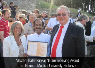 Master Healer Pankaj Naram receiving Award from German Medical University Professors